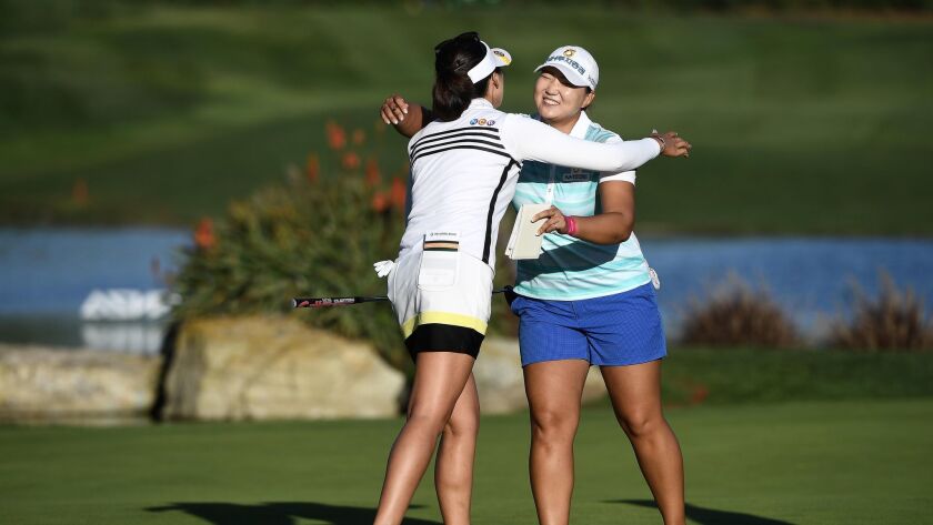 Mirim Lee of Korea hugs Mu Jung Hur of Korea after Lee's -20 under par (268) tournament record during the Final Round of the KIA Classic at the Park Hyatt Aviara Resort in Carlsbad. (Donald Miralle / Getty Images)