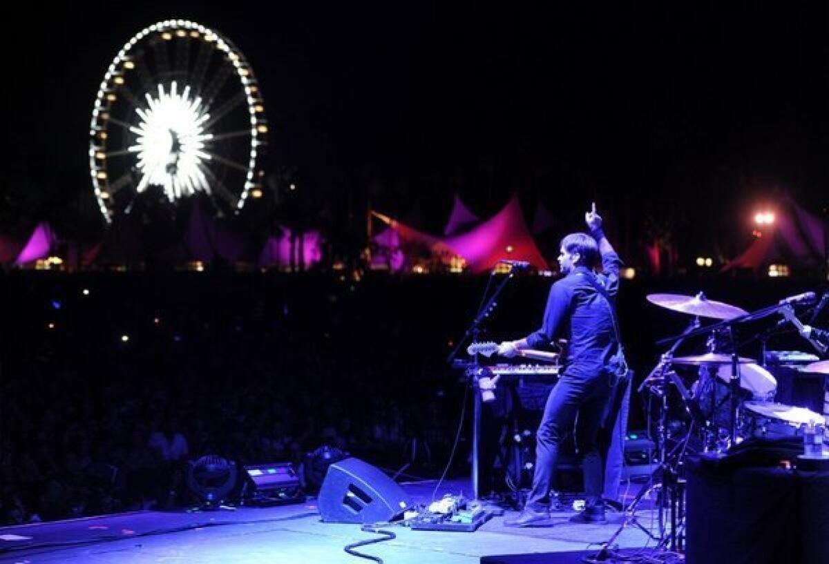 Ben Gibbard of the band The Postal Service performs onstage