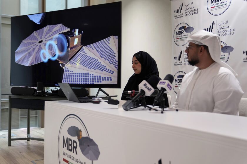 Mohsen Al Awadhi, Director of UAE Space Missions Department, 1st right, and Hoor AlMaazmi UAE, space science researcher, take part at a press conference revealing the latest news about the Emirates Mission to the Asteroid Belt, in Dubai, United Arab Emirates, Monday, May 29, 2023. The United Arab Emirates Space Agency unveiled plans Monday to build and send a spacecraft on an exploration of the main asteroid belt. Dubbed the Emirates Mission to the Asteroid Belt, the latest project by the oil-rich nation aims to develop a craft over six years and then launch it in 2028 to study various different asteroids. (AP Photo/Kamran Jebreili)