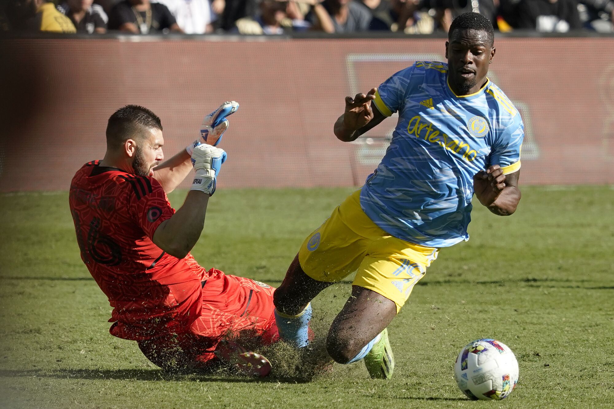 LAFC goaltender Maxime Crepeau collides with Philadelphia Union forward Cory Burke. Crepeau broke his leg in the game.