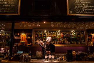 A bartender mixes a drink at El Dorado Cocktail Lounge in East Village.