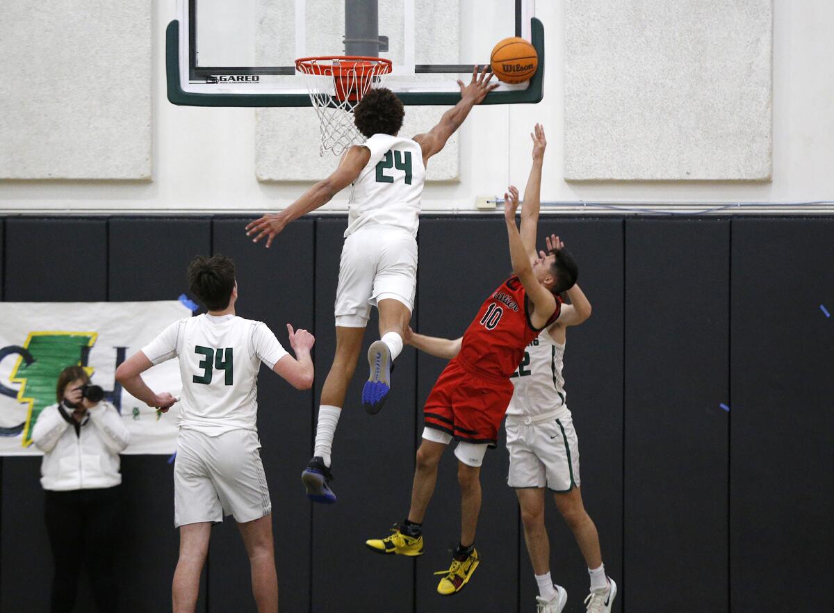 Sage Hill's Carter Bryant (24) blocks a layup off the glass by Whittier's Brandon Romo (10) on Wednesday.
