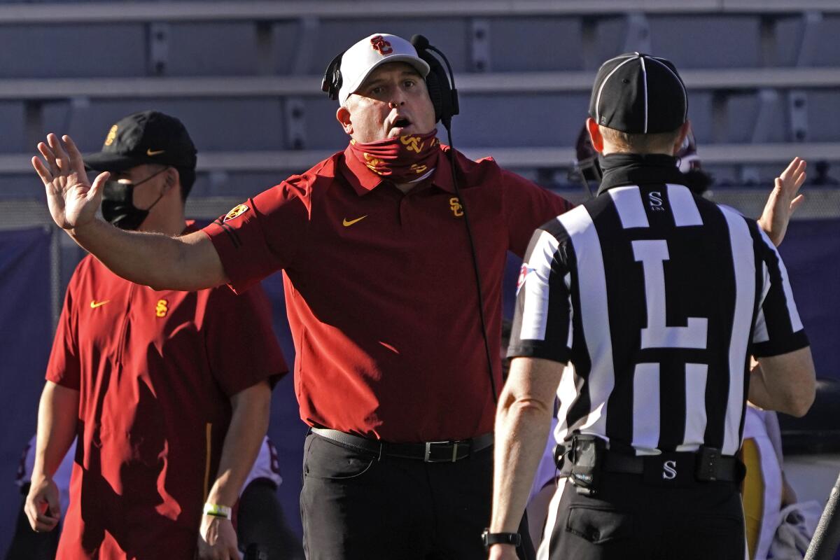 USC coach Clay Helton talks to a referee during a win over Arizona in November.