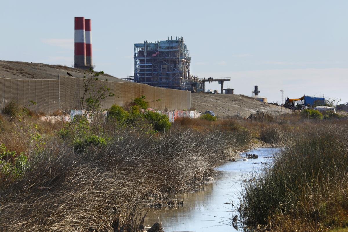 Power plants and industrial infrastructure dot the landscape along the Oxnard coast.