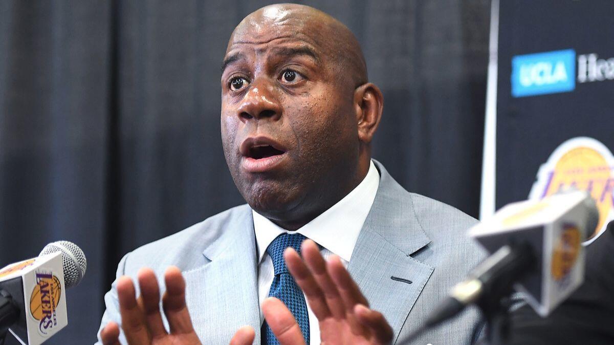 Magic Johnson, president of basketball operations for the Lakers and a co-owner of the Dodgers, speaks at a news conference on June 23.