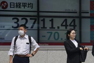 People stand by monitors showing Japan's Nikkei 225 index at a securities firm in Tokyo, Monday, June 26, 2023. Asian shares are mixed after a short-lived armed rebellion in Russia added to uncertainties over the war in Ukraine. (AP Photo/Hiro Komae)