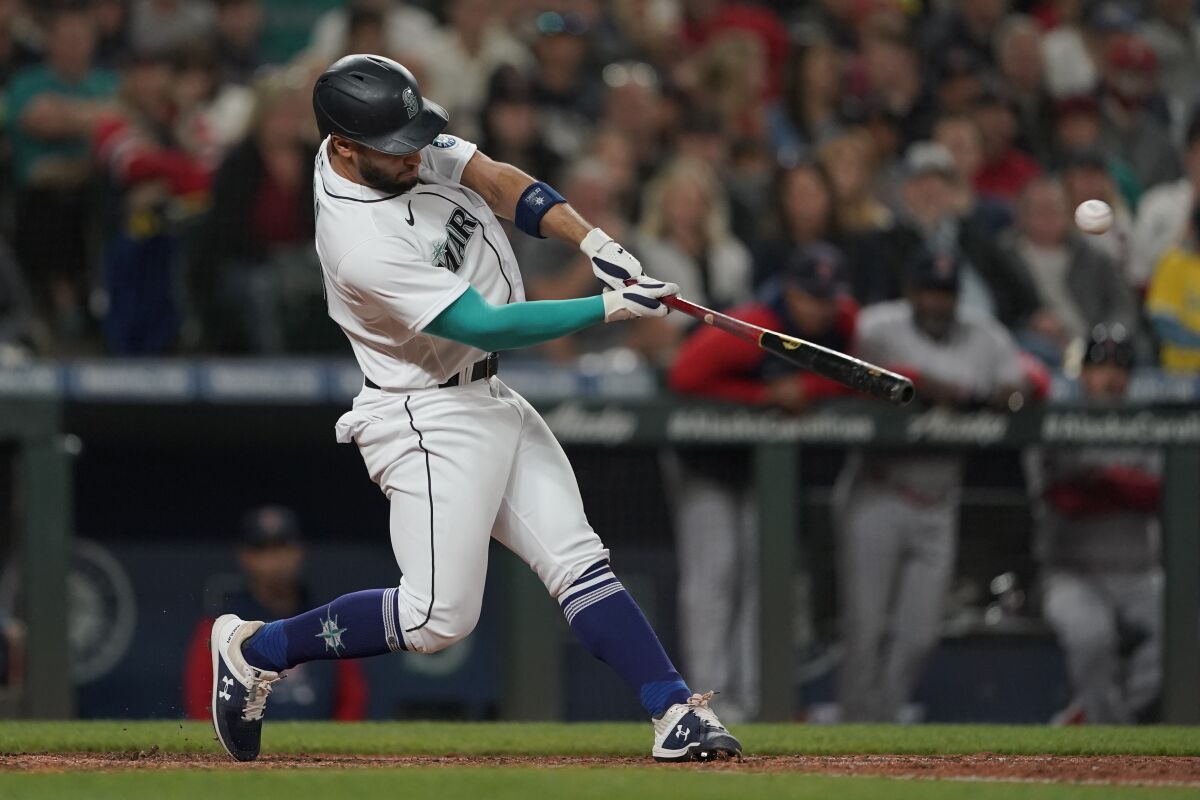 Seattle Mariners' Abraham Toro hits an RBI-double during the seventh inning of the team's baseball game against the Boston Red Sox, Saturday, June 11, 2022, in Seattle. (AP Photo/Ted S. Warren)
