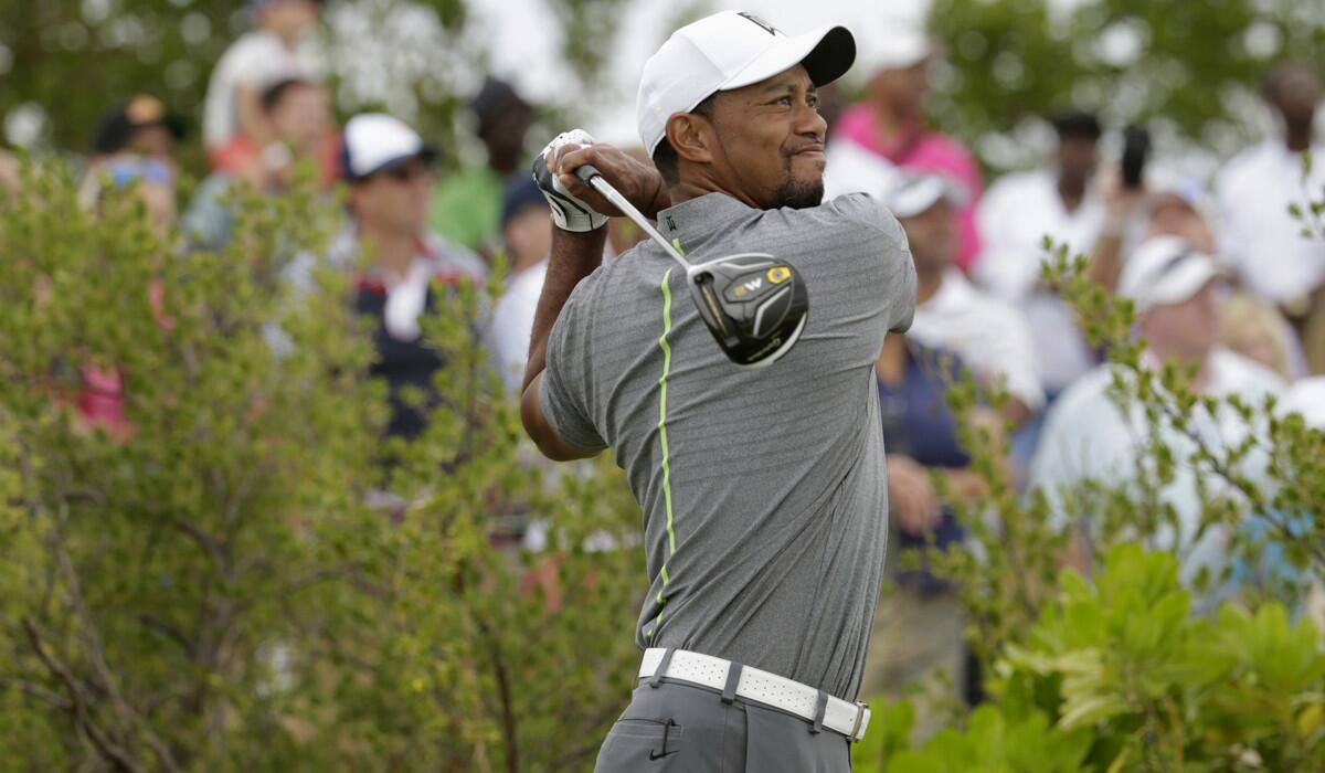 Tiger Woods watches his tee shot during the third round at the Hero World Challenge golf tournament on Dec. 3.