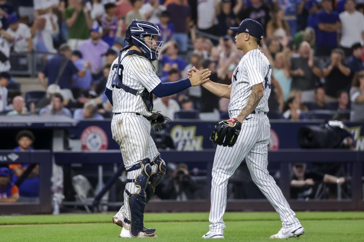 The New York Yankees celebrate their win after a baseball game