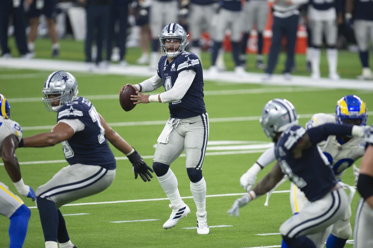 Dallas Cowboys quarterback Dak Prescott looks to pass against the Los Angeles Rams.