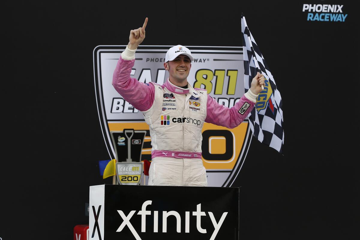 Austin Cindric celebrates in Victory Lane after winning a NASCAR Xfinity Series auto race at Phoenix Raceway, Saturday, March 13, 2021, in Avondale, Ariz. (AP Photo/Ralph Freso)