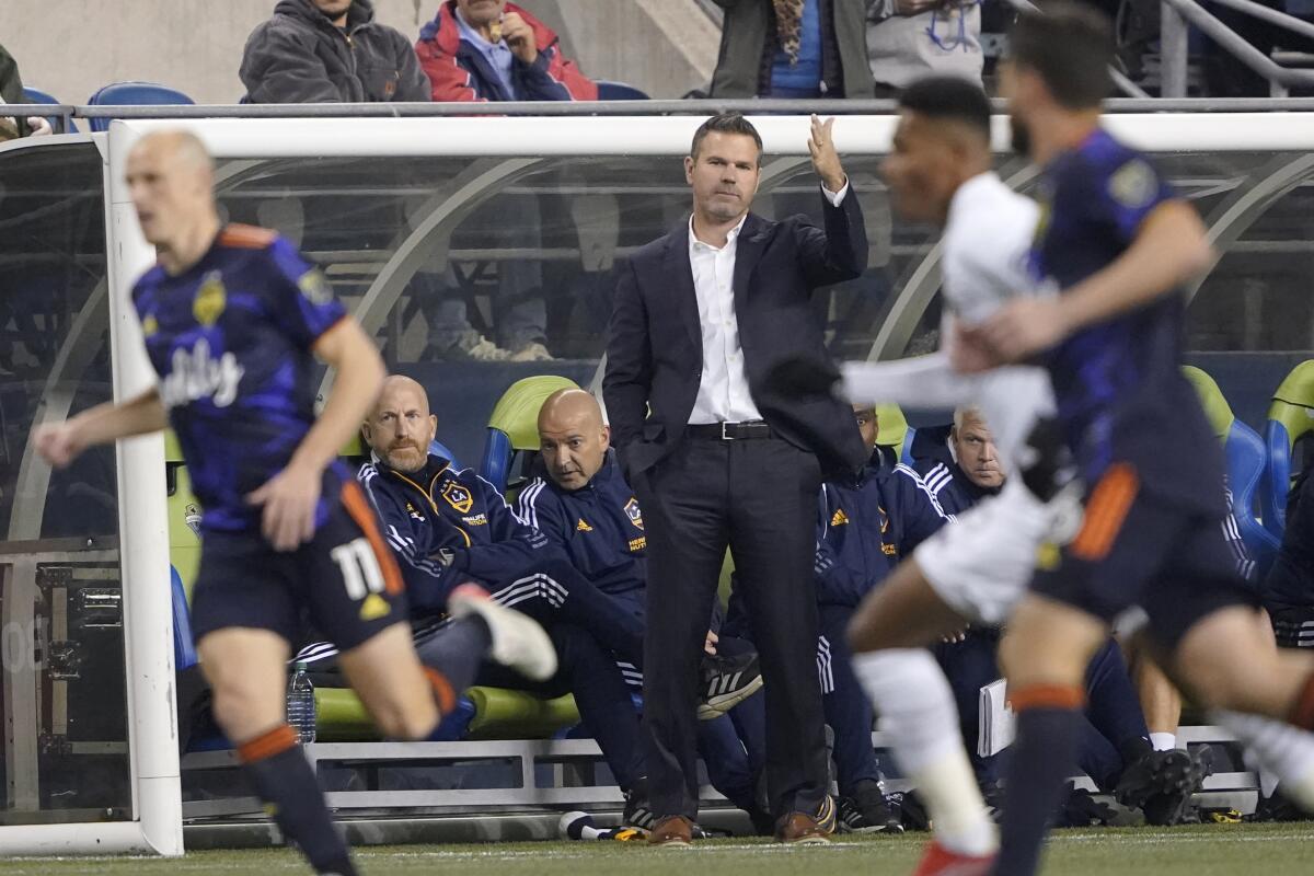 Galaxy head coach Greg Vanney, center, gestures during a draw against the Seattle Sounders on Monday.
