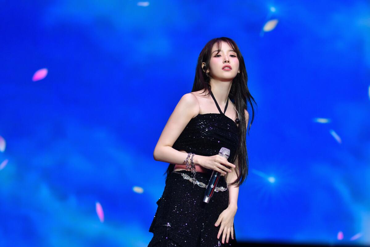 K-pop singer IU performs onstage.