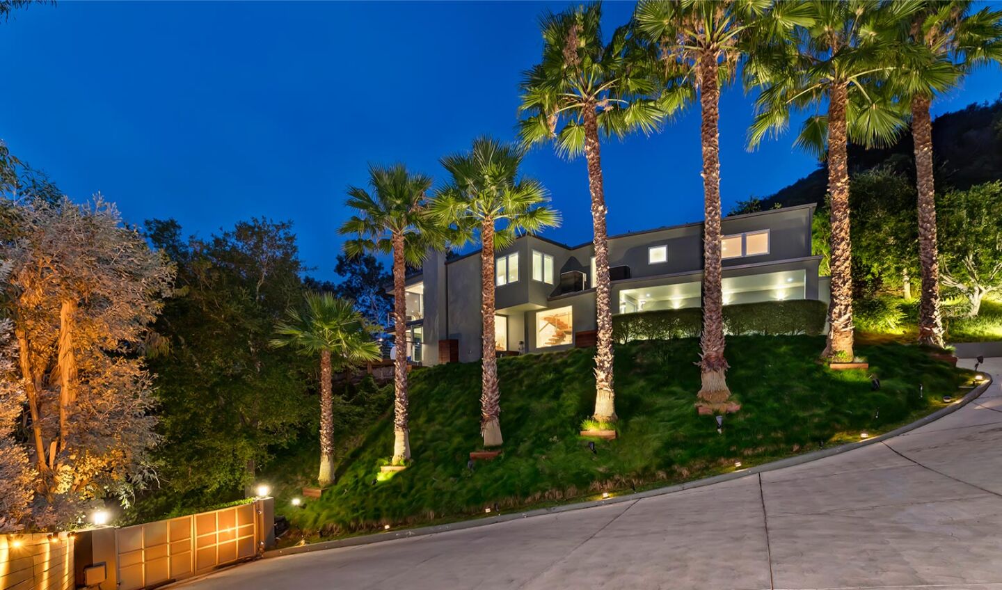 Built in the '60s, the two-story home offers 3,200 square feet of space and opens to an entertainer's deck made of limestone and Brazilian wood.