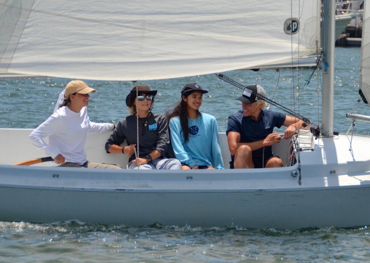 Newport Sea Base Skipper Shaybree Lynette, Taylor Gordon, Shannon Shay, and Nathan Rouget, sail on an H20.