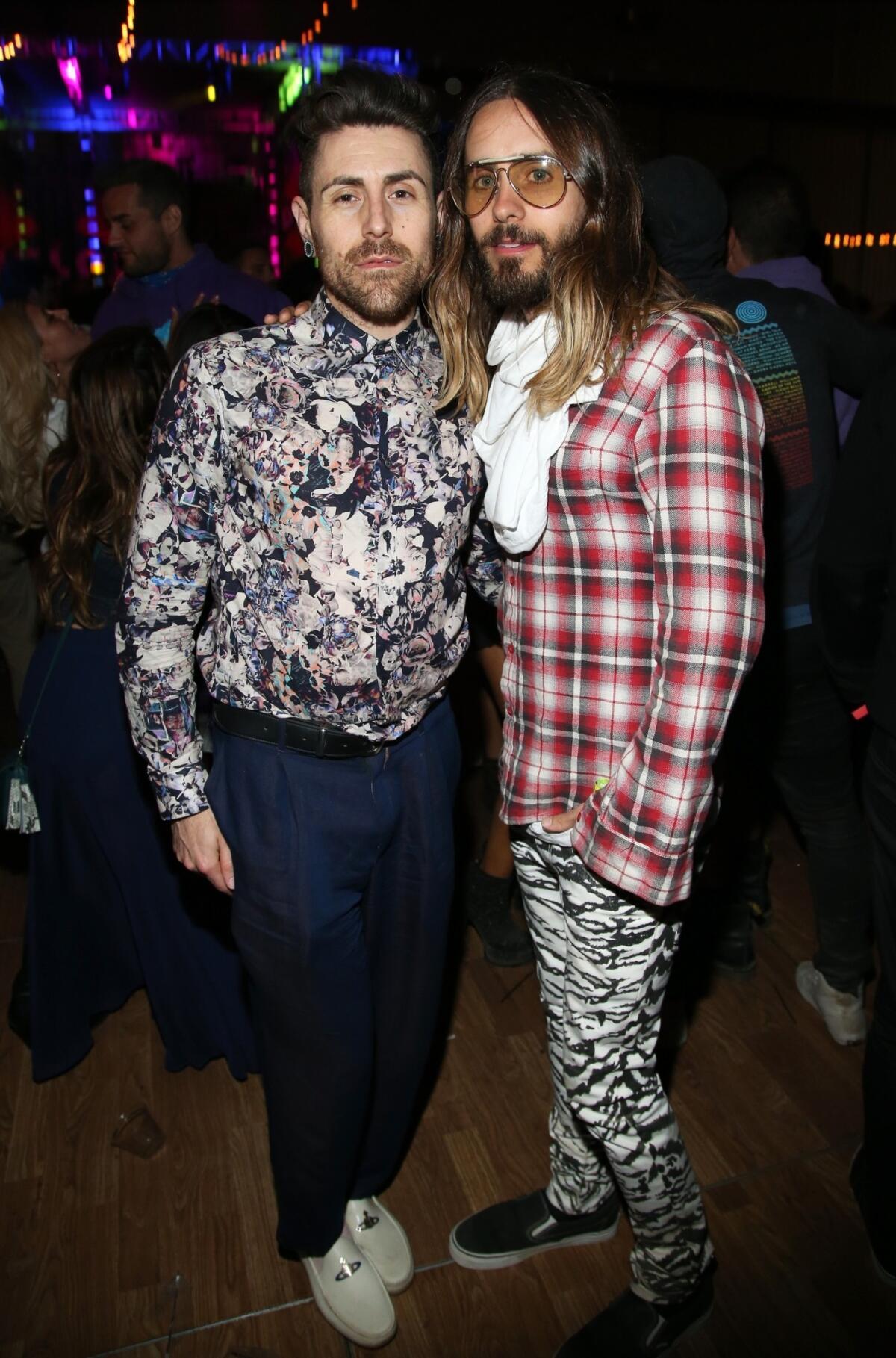 Jared Leto, right, and a guest attend Neon Carnival in Thermal, Calif., on Saturday night.