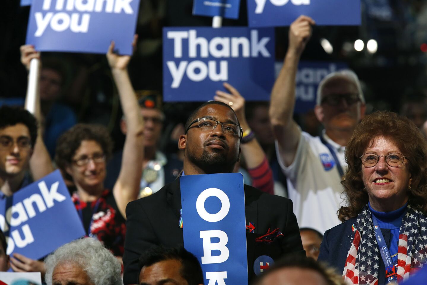 Delegates listen to President Barak Obama deliver his speech on the third day of the Democratic National Convention.