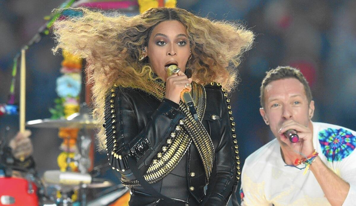 Artists like Beyoncé must walk a tightrope between promoting their art and annoying fans who may not want to subscribe to a new subscription service. Above, Beyoncé performs with Coldplay's Chris Martin during halftime at Super Bowl 50.