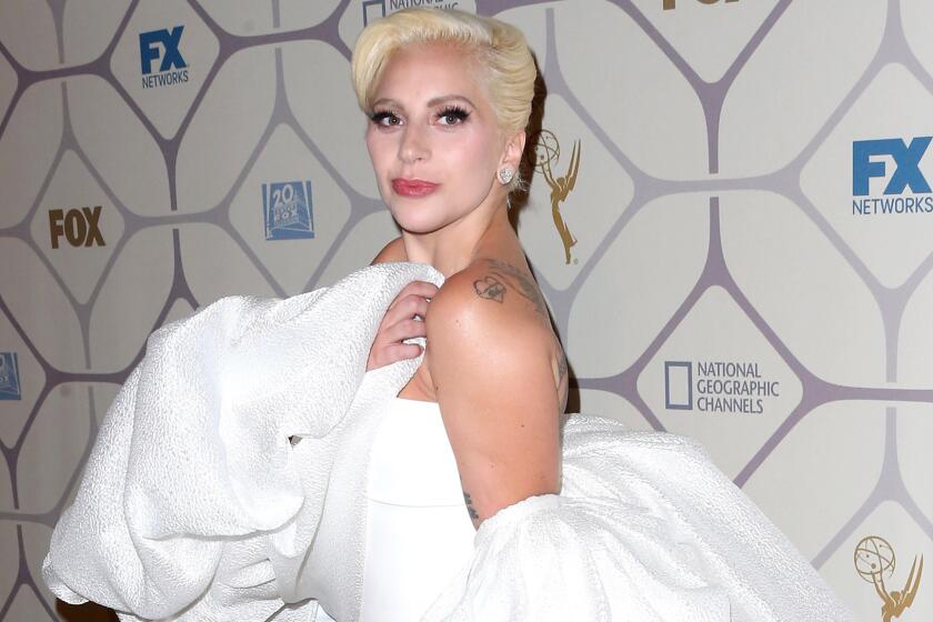 Lady Gaga, who, starting in October, will be on Fox's "American Horror Story: Hotel," changed from black to white on her way from the Emmys to the network's after-party at Vibiana in downtown L.A.