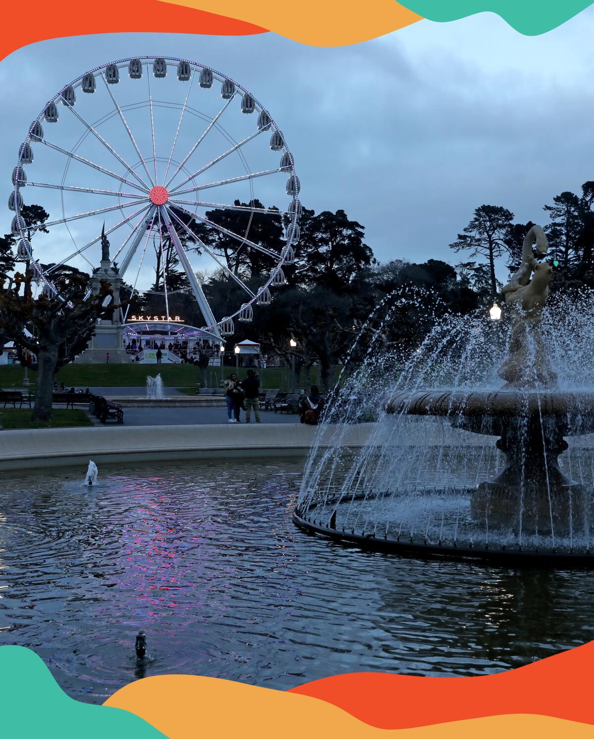 The SkyStar Observation Wheel in San Francisco's Golden Gate Park, with a large fountain in the foreground