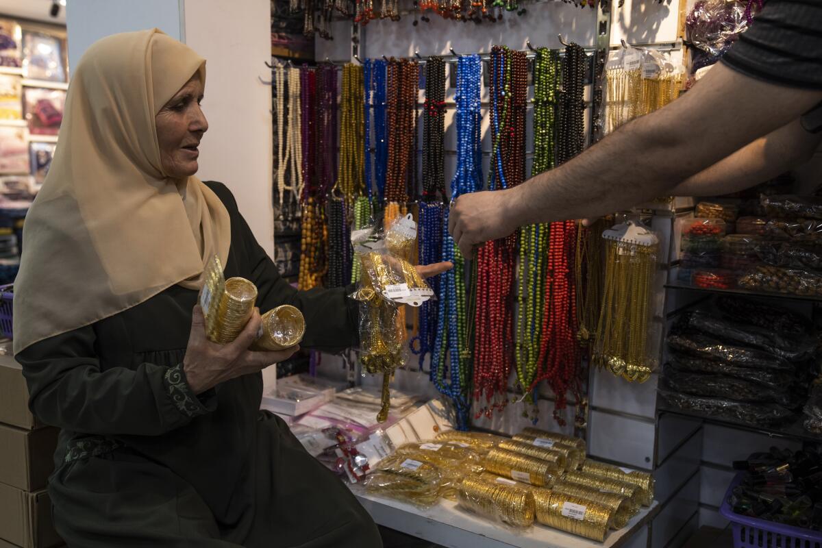 Huda Zaqqout shops for hajj in Gaza City.