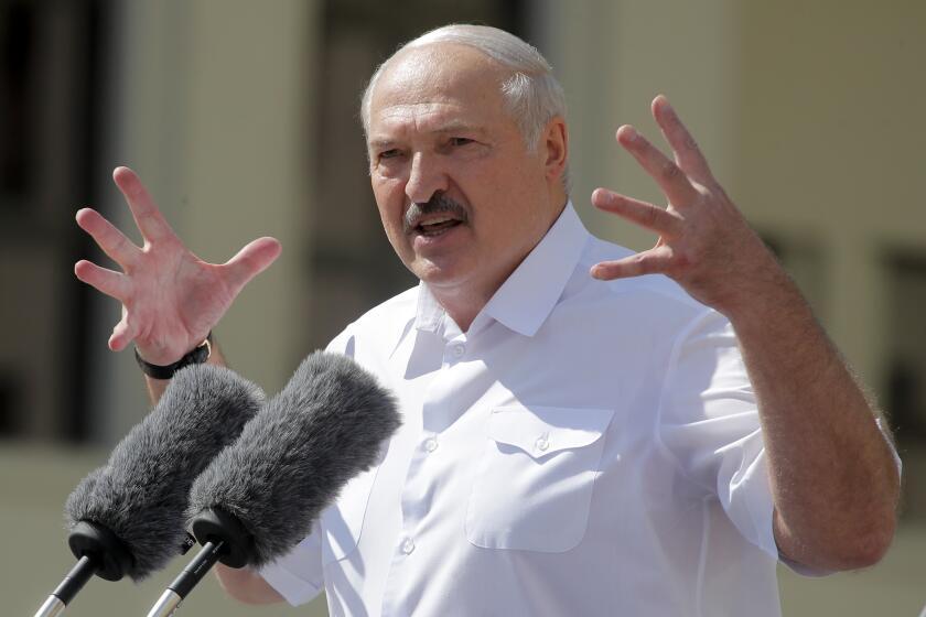 Belarusian President Alexander Lukashenko addresses his supporters gathered at Independent Square of Minsk, Belarus, Sunday, Aug. 16, 2020. Thousands of people have gathered in a square near Belarus' main government building for a rally to support President Alexander Lukashenko, while opposition supporters whose protests have convulsed the country for a week aim to hold a major march in the capital. (AP Photo/Dmitri Lovetsky)