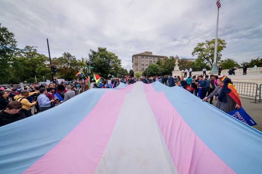 WASHINGTON DC, UNITED STATES - 2019/10/08: A giant Trans Flag unfurled outside the Supreme Court. 133 protesters were arrested blocking the street across the Supreme Court in an act of non violent civil disobedience, as hundreds of LGBTQ+ advocates convened in Washington, DC for a national day of action as a community response to the landmark Supreme Court hearings that could legalize workplace discrimination, primarily against LGBTQ+ people, on the basis of sexual orientation, gender identity, and gender presentation. (Photo by Erik McGregor/LightRocket via Getty Images)