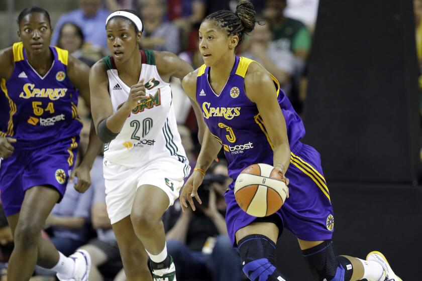 Candace Parker, right, shown with the Sparks last May, won't be ready to play with her WNBA team when the season starts in June.