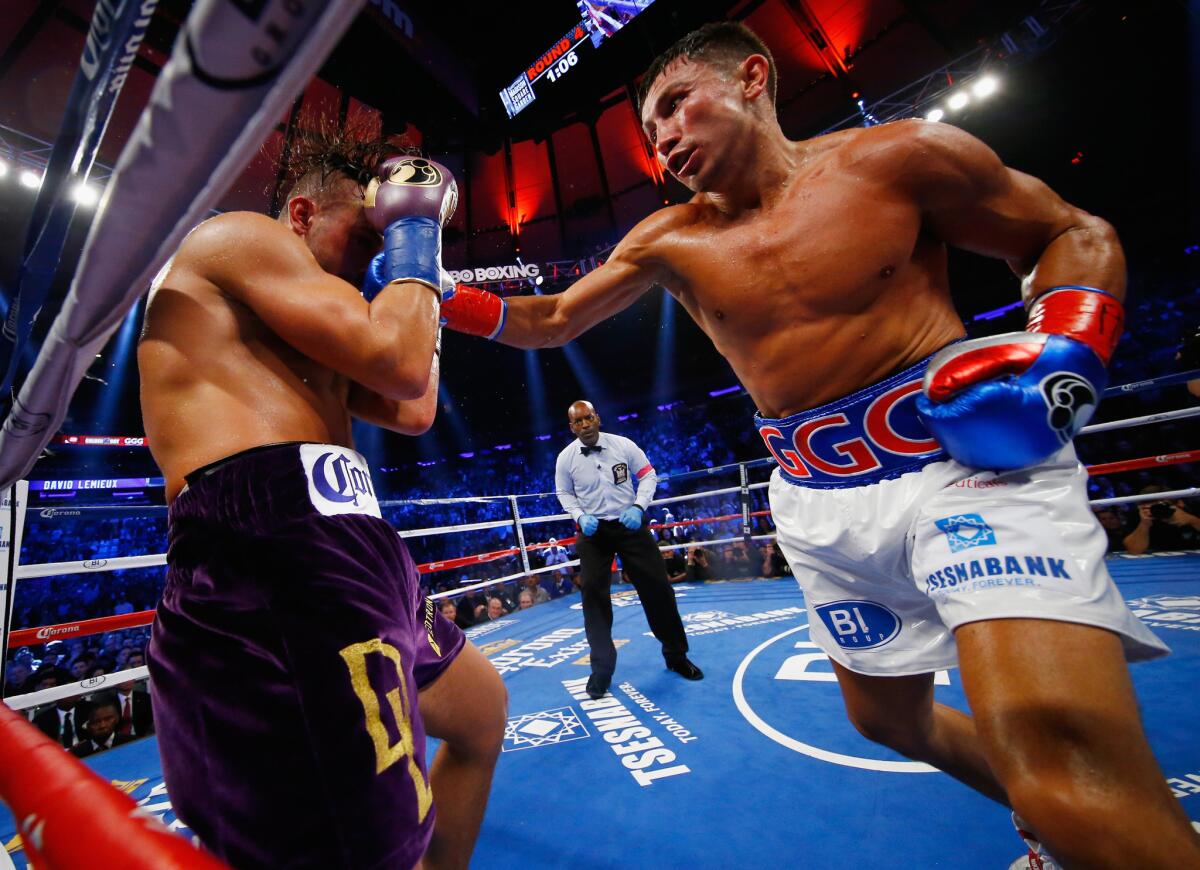 Gennady Golovkin, right, lands a right against David Lemieux during their middleweight title unification bout at Madison Square Garden.