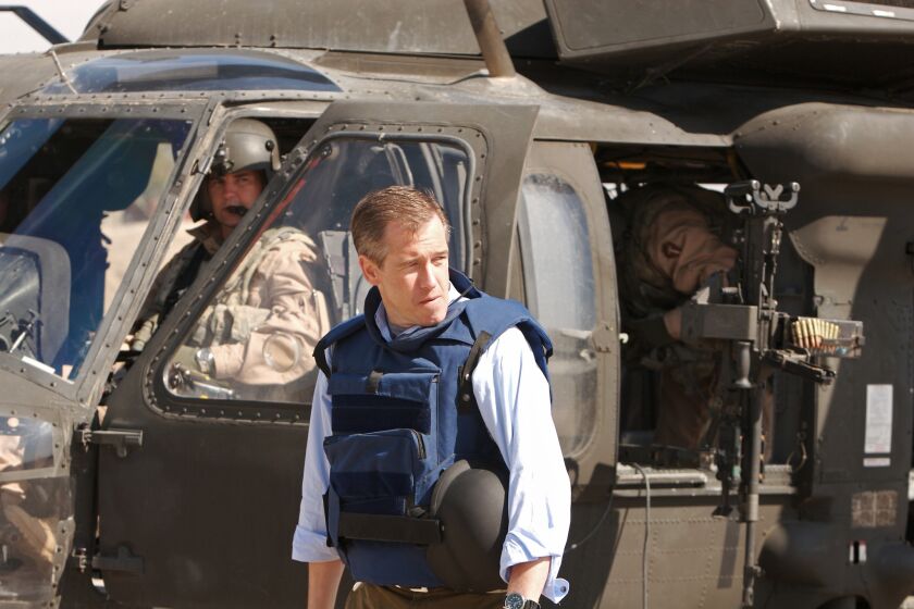 NBC News anchor Brian Williams stands beside a helicopter while on assignment in March 2007 in Baghdad.