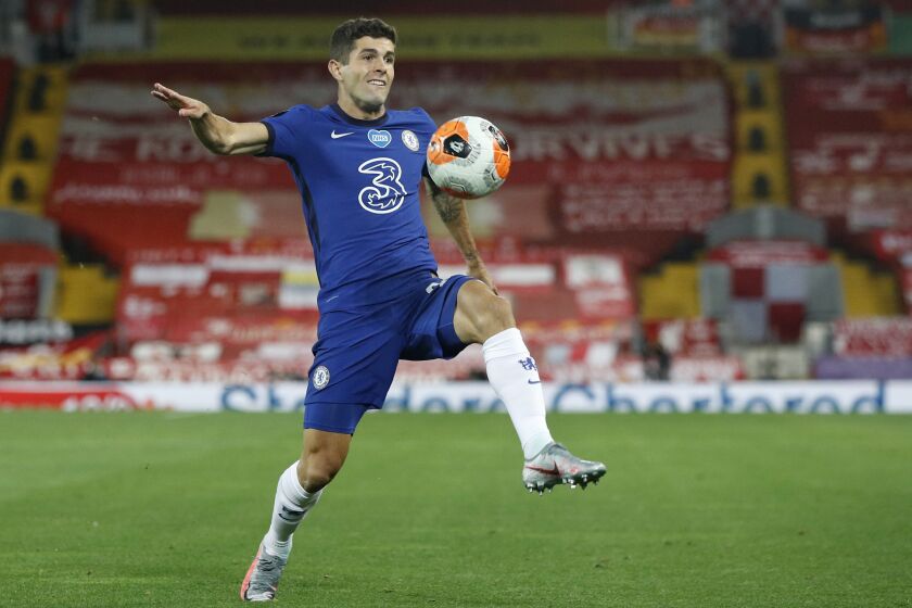 FILE - In this Wednesday, July 22, 2020 file photo, Chelsea's Christian Pulisic controls the ball during the English Premier League soccer match between Liverpool and Chelsea at Anfield Stadium in Liverpool, England. Frank Lampard’s squad has certainly seen the most intriguing changes ahead of the new campaign - having been banned from signing players last summer, they have looked to make up for lost time and recruited some big names to replace long-term servants such as Pedro and Willian. (Phil Noble/Pool via AP, file)