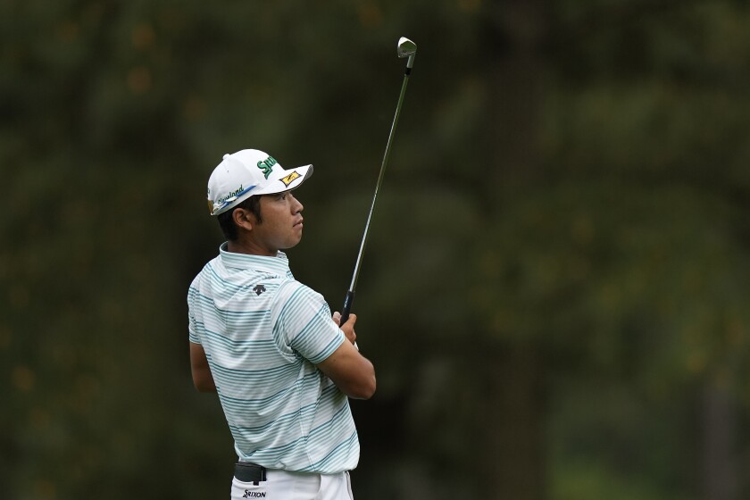 FILE - Hideki Matsuyama, of Japan, watches his shot on the 15th hole during the third round of the Masters golf tournament April 10, 2021, in Augusta, Ga. Matsuyama made eagle to take the lead for good, the defining shot of his Masters victory. (AP Photo/David J. Phillip, File)