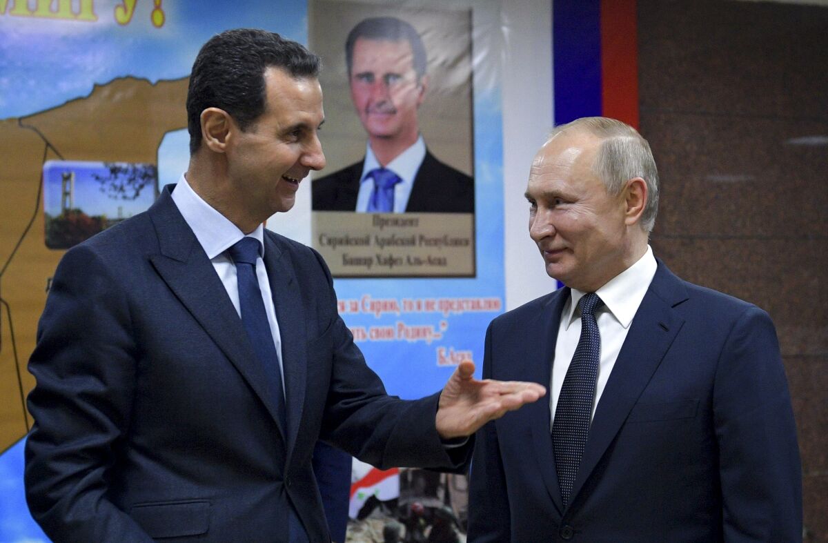  Syrian President Bashar Assad speaking with Russian President Vladimir Putin.