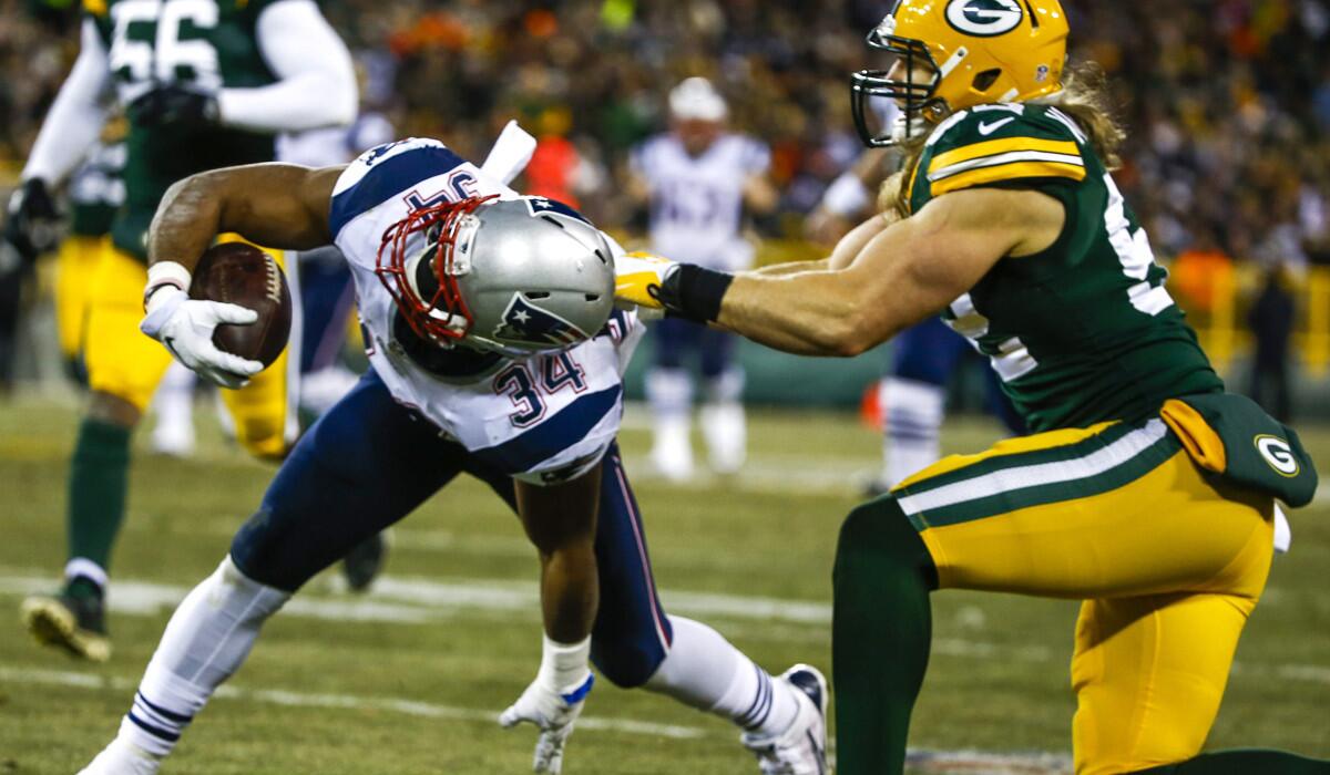 Patriots running back Shane Vereen is brought down by Packers linebacker Clay Matthews in the first half Sunday.