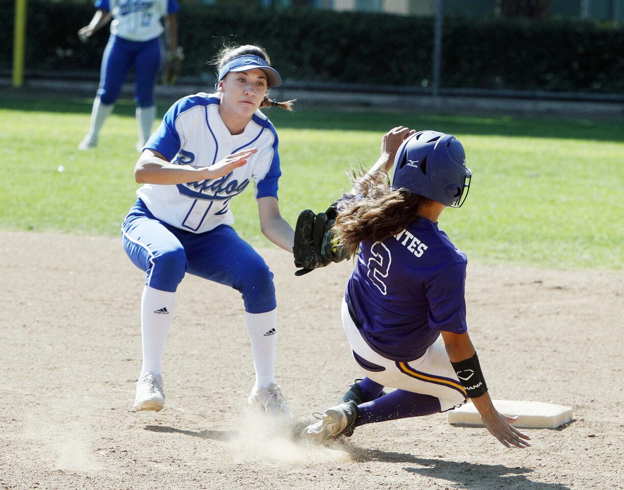 Burbank's Katie Treadway tags out Norwalk's Destanie Cervantes at second base in a CIF Division IV wild-card softball game at McCambridge Park in Burbank on Tuesday, May 15, 2018. Norwalk won the game 4-2.
