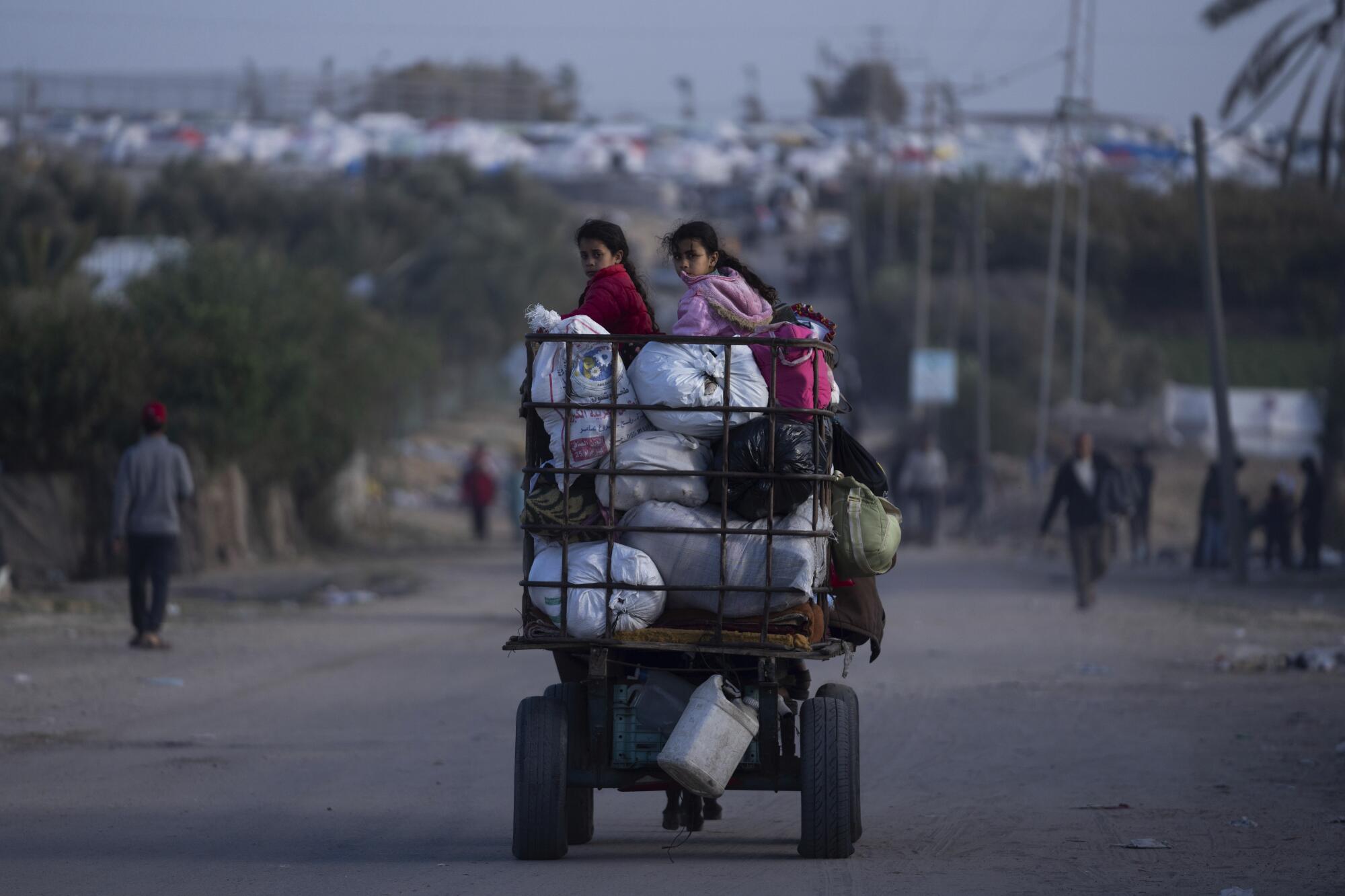 Gazans fleeing Khan Yunis on laden vehicle