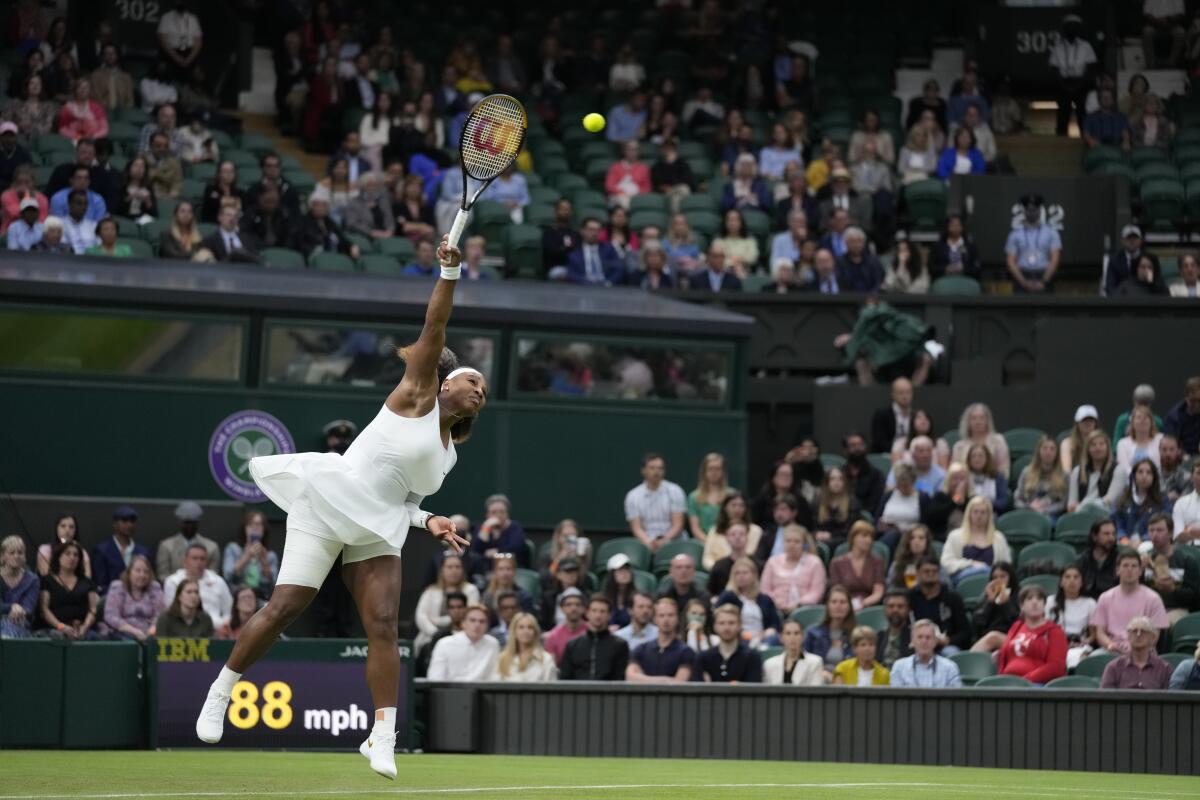 Serena Williams serves before her injury Tuesday.