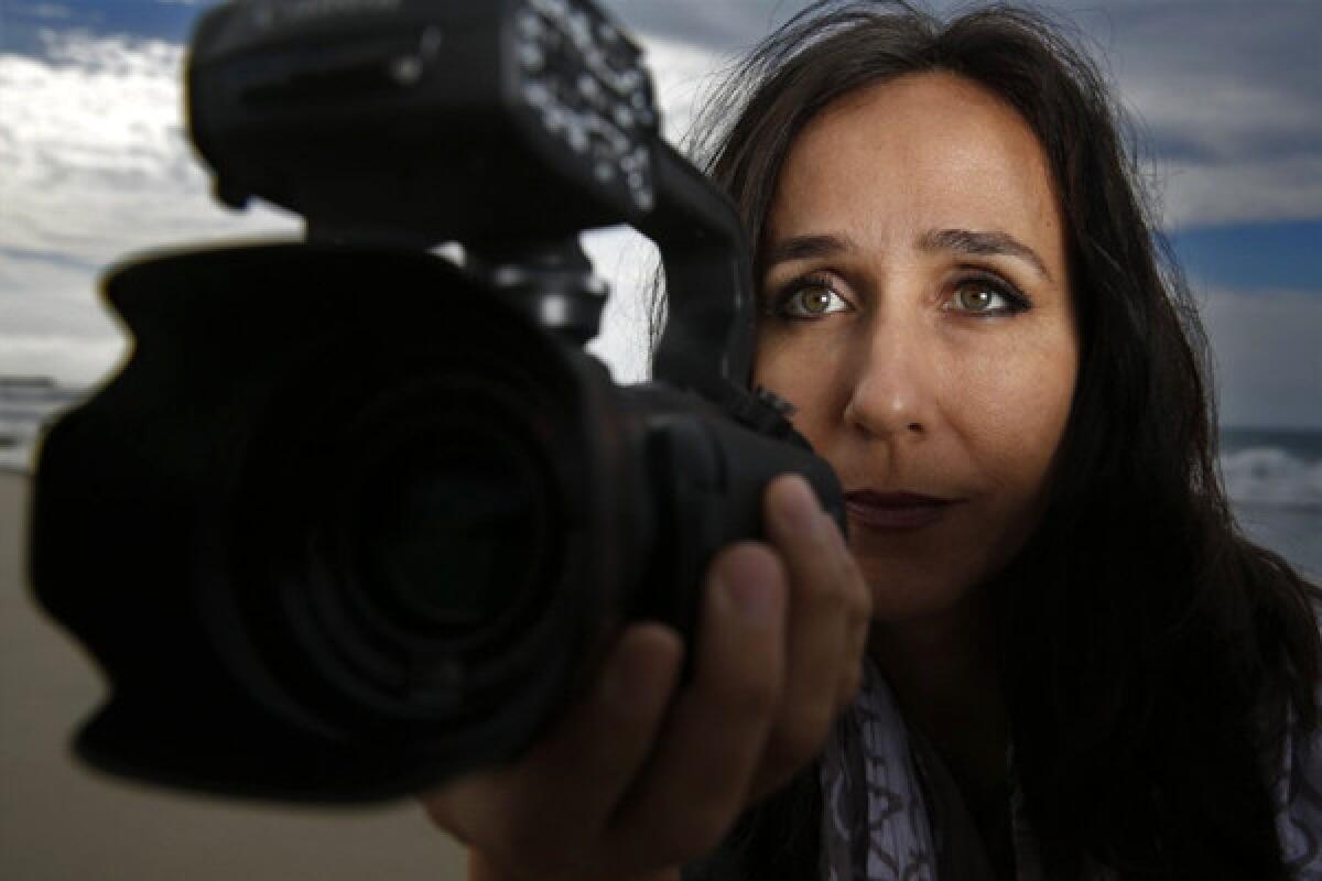 Documentary film maker Gabriela Cowperthwaite poses on a Los Angeles, CA, beach on Nov 19, 2013. She produced the film "Blackfish" which has become a rallying cry to free orca whales from captivity at marine parks such as Sea World.