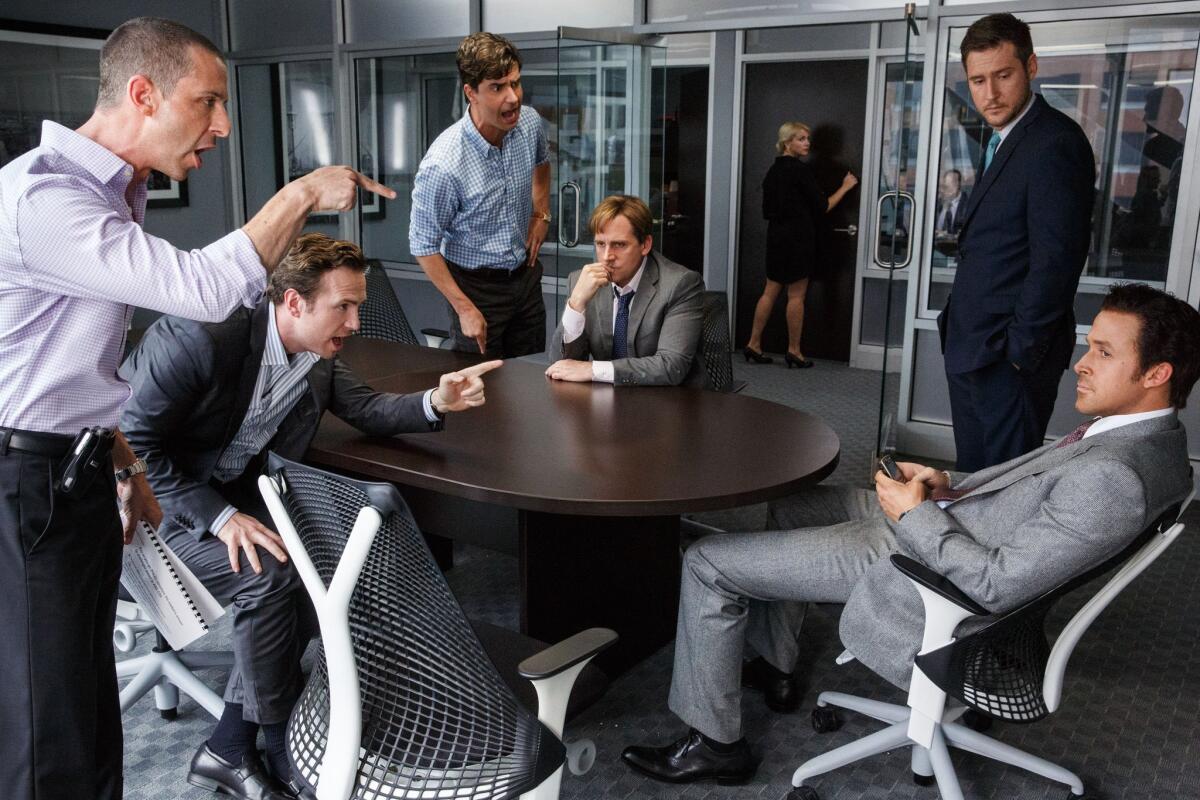 Actors Jeremy Strong, from left, Rafe Spall, Hamish Linklater, Steve Carell, Jeffry Griffin and Ryan Gosling star in "The Big Short."