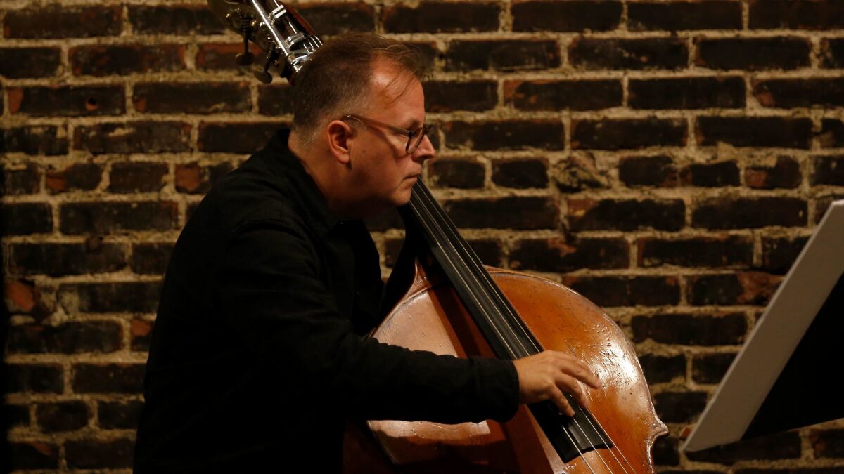 Bassist Tom Peters plays Luciano Berio's Sequenza XIVb at Monk Space in Los Angeles on Tuesday night.