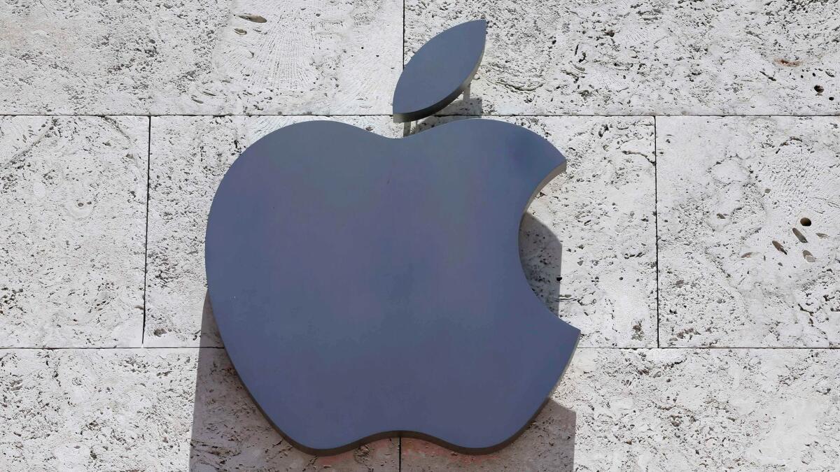 Apple's logo is displayed on a building.