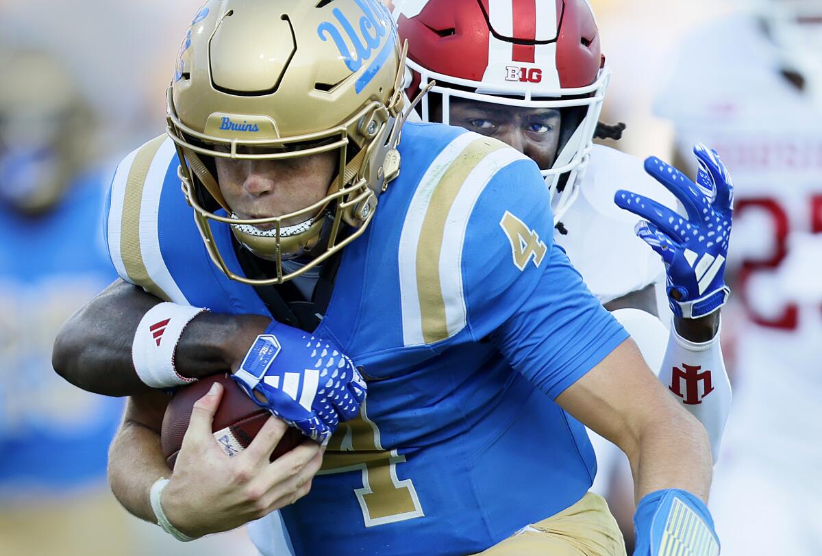 Indiana strong safety Josh Sanguinetti tackles UCLA quarterback Ethan Garbers at the Rose Bowl on Saturday.