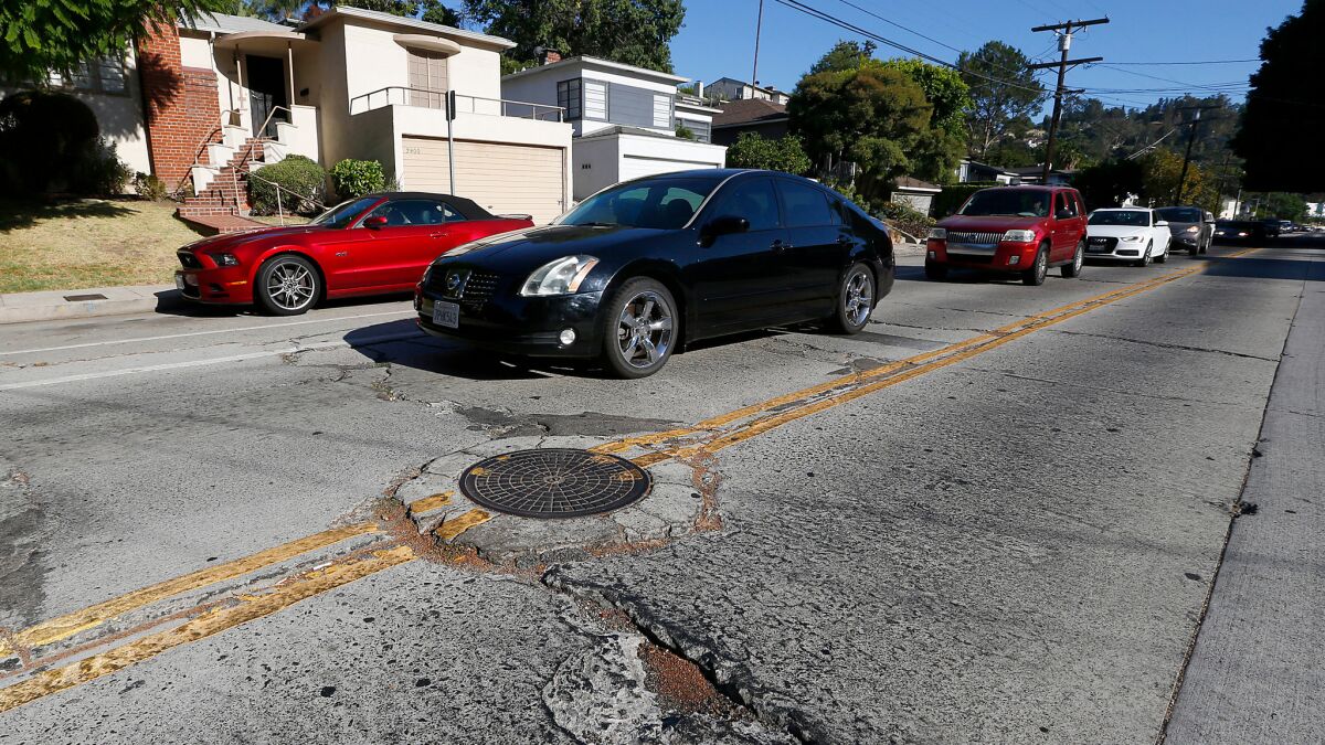The streets are cracked and patched at Griffith Park Boulevard and Tracy Street in Silver Lake.