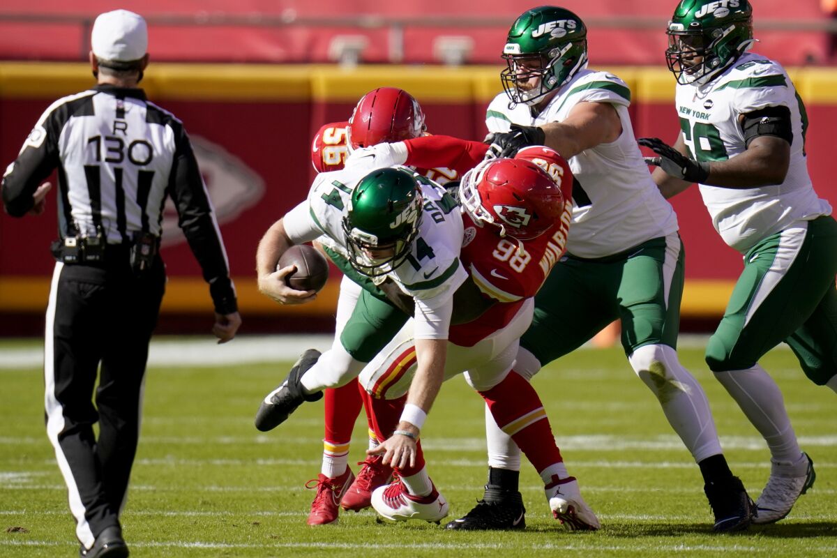 New York Jets quarterback Sam Darnold (14) is sacked by Kansas City Chiefs defensive tackle Tershawn Wharton (98) in the first half of an NFL football game on Sunday, Nov. 1, 2020, in Kansas City, Mo. (AP Photo/Jeff Roberson)