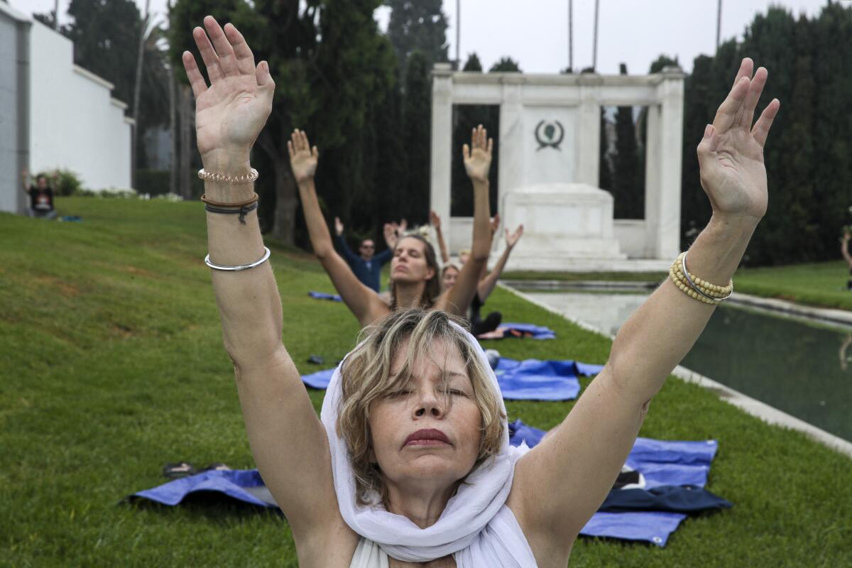 Jennifer Drake takes part in a hypno-yoga class 