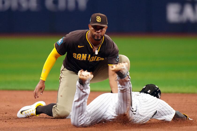 SEOUL, SOUTH KOREA - MARCH 18: Xander Bogaerts #2 of the San Diego Padres tags out Moon Bo-gyeong #2 of the L.G. Twins on a stolen base attempt during the 2024 Seoul Series game between the San Diego Padres and the LG Twins at Gocheok Sky Dome on Monday, March 18, 2024 in Seoul, South Korea. (Photo by Daniel Shirey/MLB Photos via Getty Images)