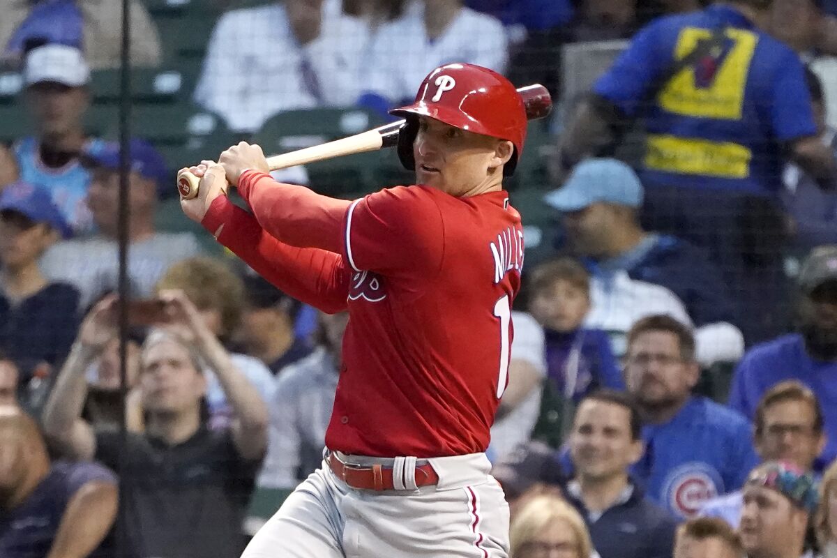Philadelphia Phillies' Brad Miller watches his home run off Chicago Cubs starting pitcher Adbert Alzolay during the third inning of a baseball game Thursday, July 8, 2021, in Chicago. (AP Photo/Charles Rex Arbogast)