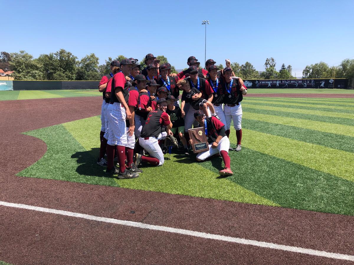 JSerra's baseball team gathers for a photo after winning the championship game.