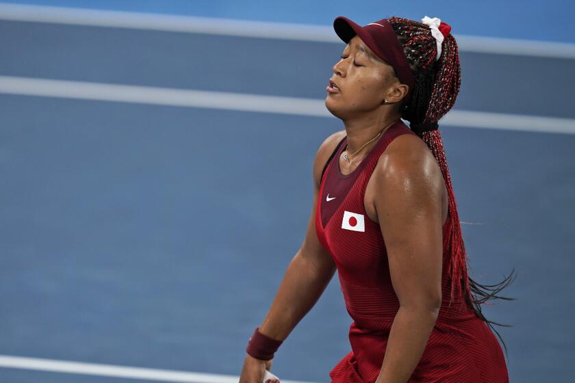 Naomi Osaka, of Japan, reacts after losing a point to Marketa Vondrousova.