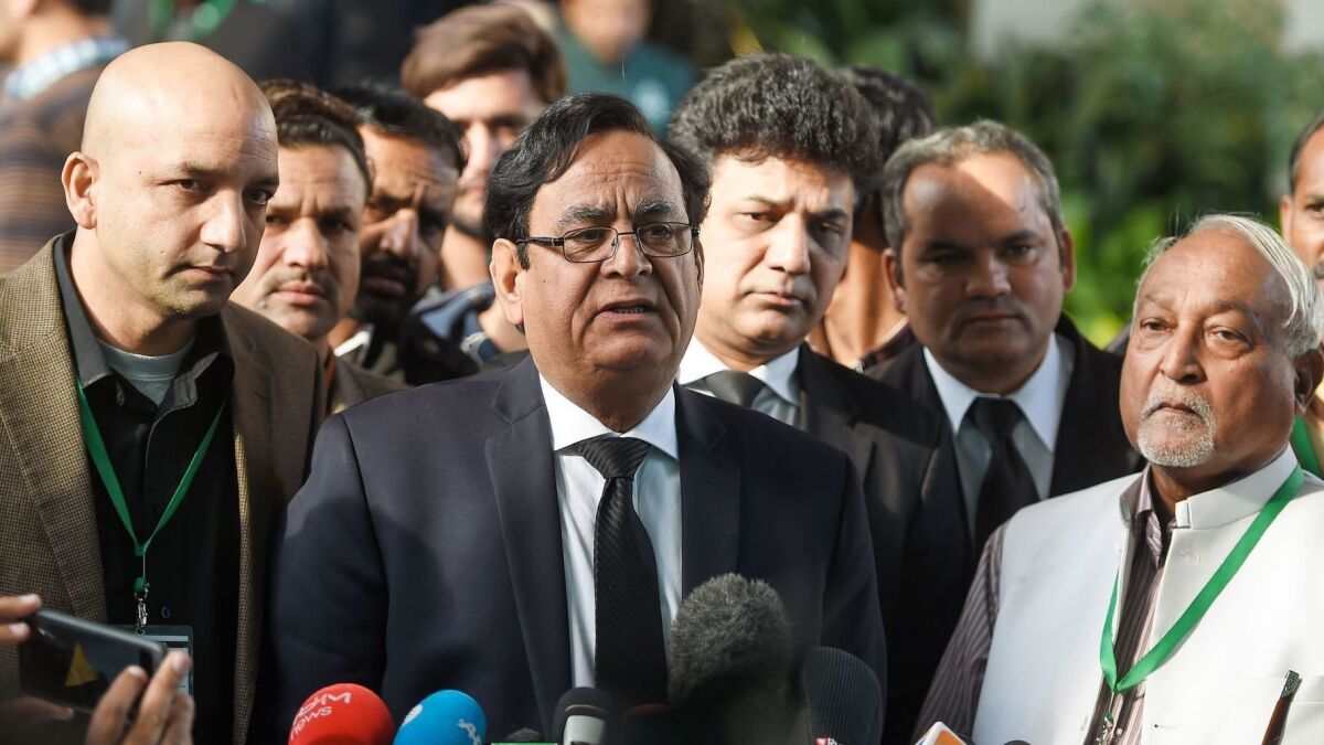 Saiful Malook, center, the lawyer for Asia Bibi, speaks to the media outside the Supreme Court building in Islamabad, Pakistan, on Jan. 29.